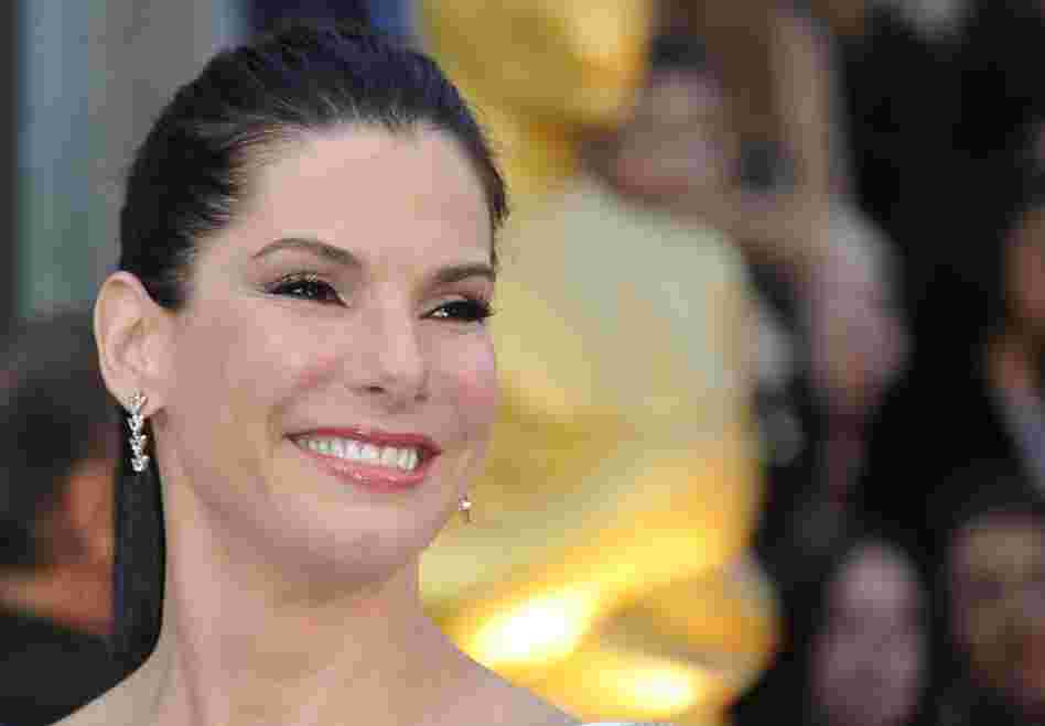 This is Sandra Bullock at the 2012 Oscars. Sunday, she's watching the Super Bowl. This is Sandra Bullock at the 2012 Oscars. Sunday, she's watching the Super Bowl.