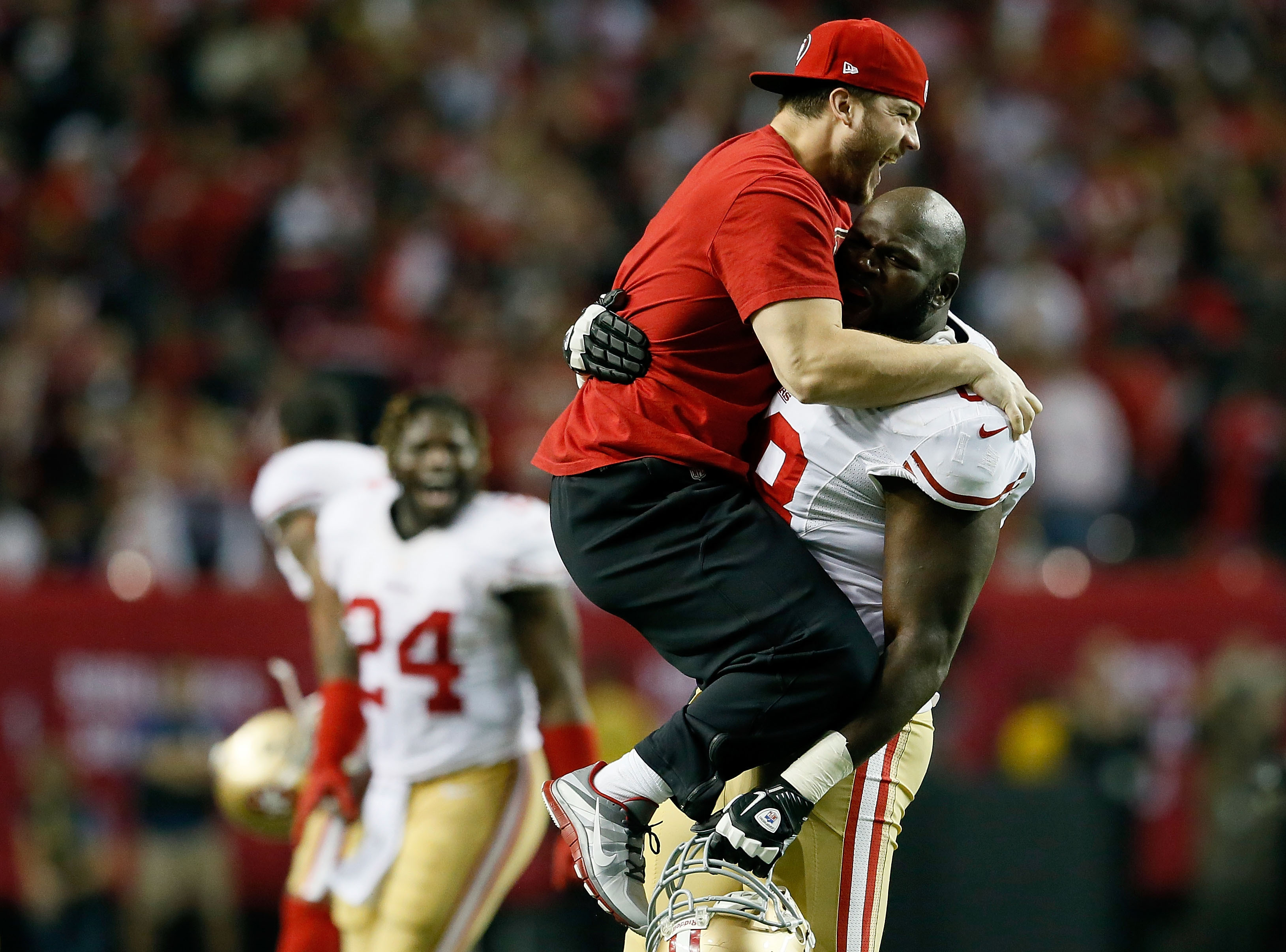 Practice squad player Nate Stupar and guard Leonard Davis of the San Francisco 49ers celebrate during the NFC Championship game on January 20.