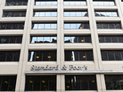 A sign for Standard & Poor's rating agency stands in front of the company headquarters in New York. A sign for Standard & Poor's rating agency stands in front of the company headquarters in New York.