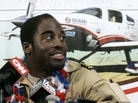 Barrington Irving , a 23-year-old Jamaican-born pilot, at a news conference at Opa-locka Airport Wednesday, June 27, 2007, ending a three-month journey he said would make him the youngest person to fly around the world alone. Barrington Irving , a 23-year-old Jamaican-born pilot, at a news conference at Opa-locka Airport Wednesday, June 27, 2007, ending a three-month journey he said would make him the youngest person to fly around the world alone.