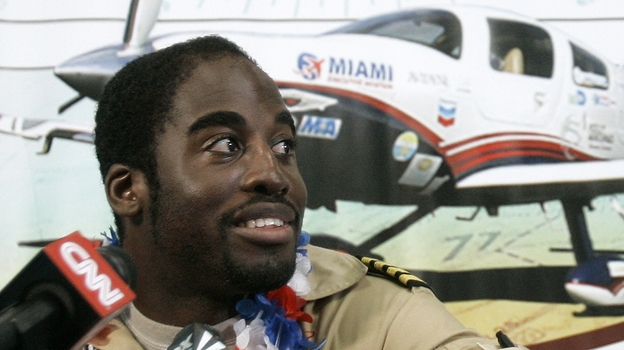 Barrington Irving , a 23-year-old Jamaican-born pilot, at a news conference at Opa-locka Airport Wednesday, June 27, 2007, ending a three-month journey he said would make him the youngest person to fly around the world alone. Barrington Irving , a 23-year-old Jamaican-born pilot, at a news conference at Opa-locka Airport Wednesday, June 27, 2007, ending a three-month journey he said would make him the youngest person to fly around the world alone.