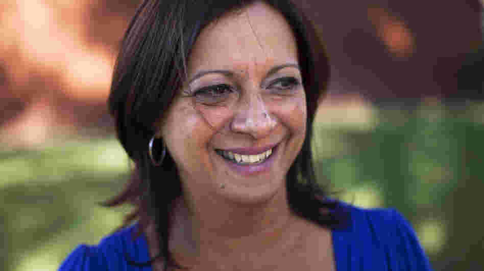 Arlene Bonet settled in Orlando, Fla., after her Puerto Rico real estate business crashed. She's now working for a Puerto Rican cultural organization in Orlando, while her son and mother still live in her hometown, Cabo Rojo, Puerto Rico.