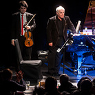 Conductor and pianist Daniel Barenboim (center) brought members of his West-Eastern Divan Orchestra (including his son Michael Barenboim, left, and Kinan Azmeh) to the intimate spaces of Manhattan's Le Poisson Rouge. Conductor and pianist Daniel Barenboim (center) brought members of his West-Eastern Divan Orchestra (including his son Michael Barenboim, left, and Kinan Azmeh) to the intimate spaces of Manhattan's Le Poisson Rouge.