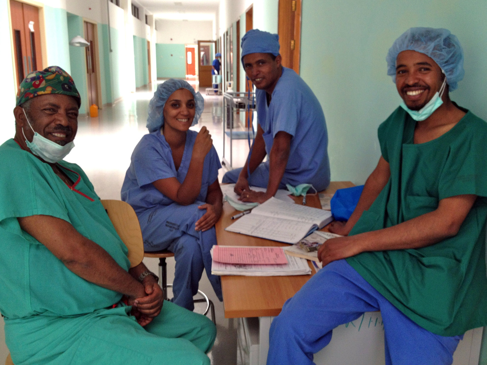Dr. Ambereen Sleemi (second from the left) traveled to Eritrea to help start an obstetrics training program. Here she relaxes in the new ward with Dr. Haile Habte Melecot (from left), a resident student and Dr Dawit Sereke.