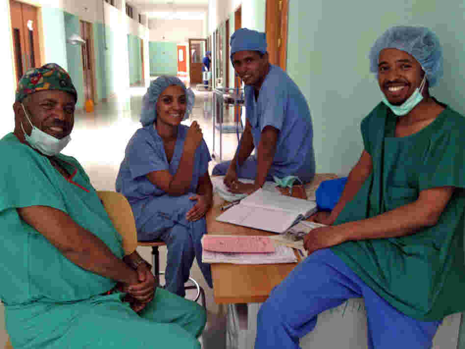 Dr. Ambereen Sleemi (second from the left) traveled to Eritrea to help start an obstetrics training program. Here she relaxes in the new ward with Dr. Haile Habte Melecot (from left), a resident student and Dr Dawit Sereke.