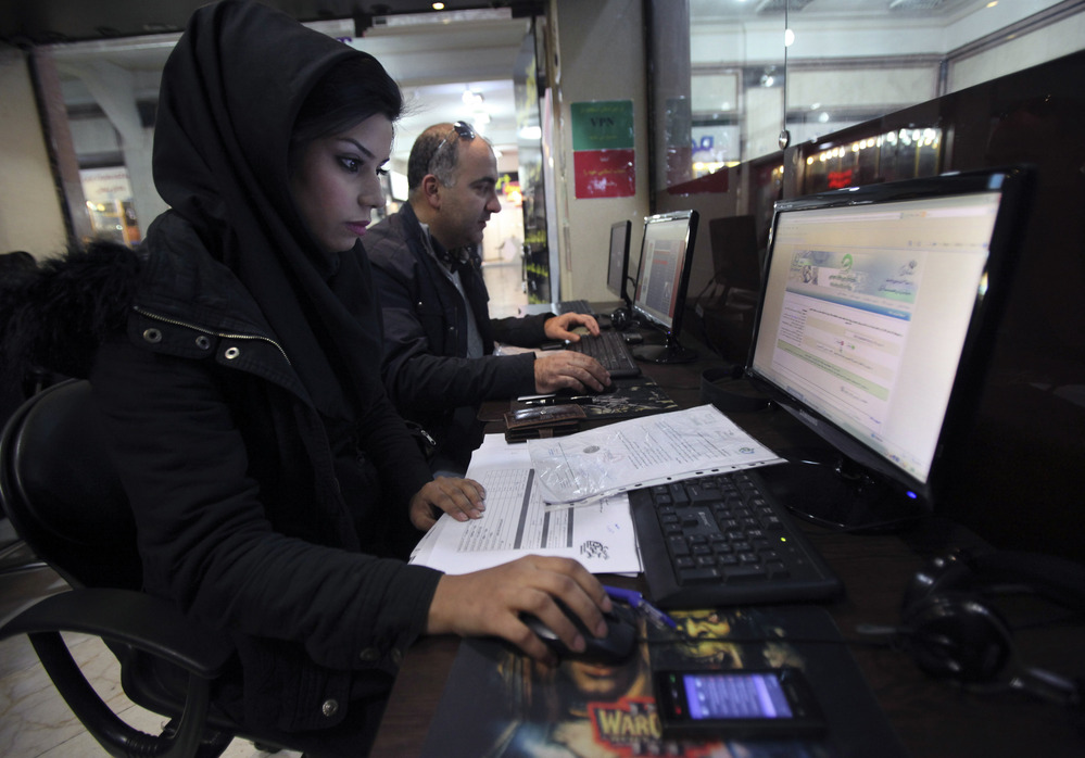 Iranian authorities are using cyberpolice units to crack down on people who try to access banned websites, including social media sites such as Facebook. Here, Iranians use computers at an Internet cafe in Tehran in January.