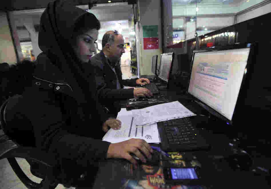 Iranian authorities are using cyberpolice units to crack down on people who try to access banned websites, including social media sites such as Facebook. Here, Iranians use computers at an Internet cafe in Tehran in January.