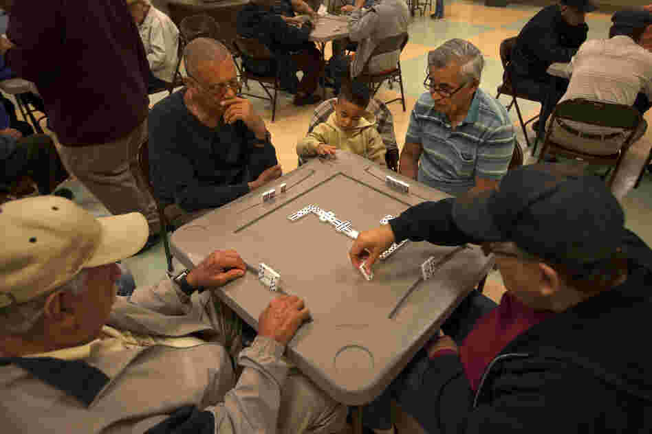 A group of men plays dominoes at the Robert Guevara Community Center in the heart of the Buenaventura Lakes neighborhood in Kissimmee. Today, Florida has replaced New York as the primary destination for Puerto Ricans coming to the mainland.