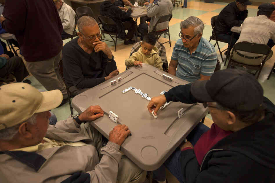 A group of men plays dominoes at the Robert Guevara Community Center in the heart of the Buenaventura Lakes neighborhood in Kissimmee. Today, Florida has replaced New York as the primary destination for Puerto Ricans coming to the mainland.