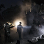Syrians look for survivors amid the rubble of a building targeted by a missile in the al-Mashhad neighborhood of Aleppo on Jan. 7.