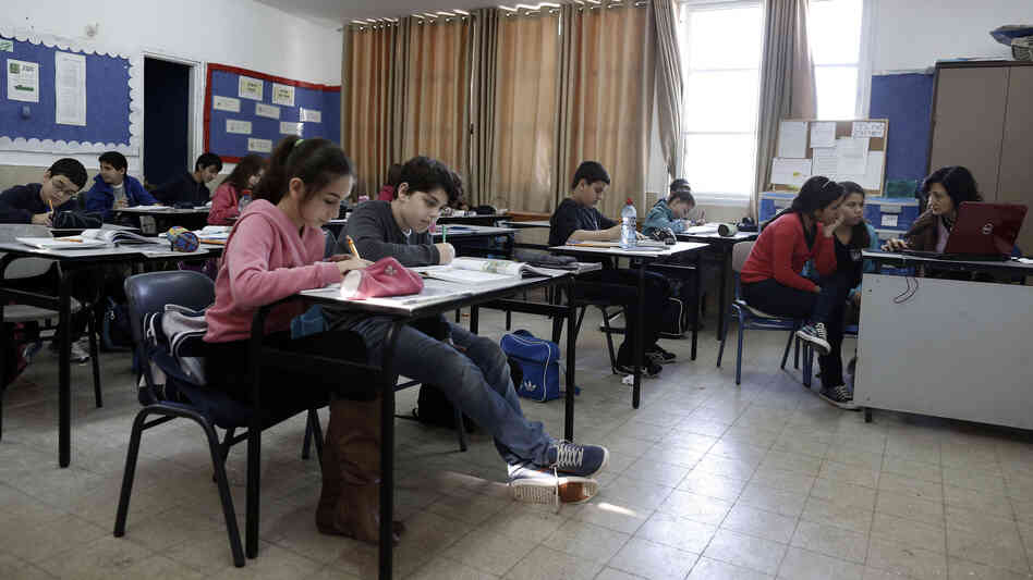 Israeli students attend class at an elementary school in the coastal city of Ashkelon. A U.S.-funded study released Monday said both Israeli and Palestinian textbooks present largely one-sided narratives of their conflict but rarely resort to demonization of the other side.