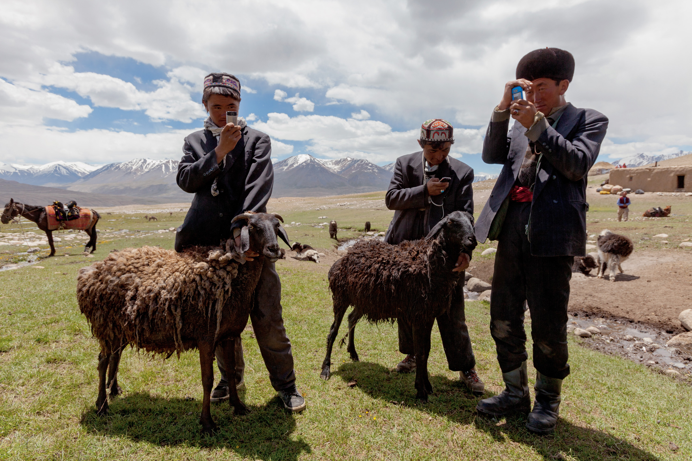 Kyrgyz herders adore their cellphones, which they acquire by trading and keep charged with solar-powered car batteries. Though useless for communication -- cellular service doesn't reach the isolated plateau -- the gadgets are used to play music and take photos.