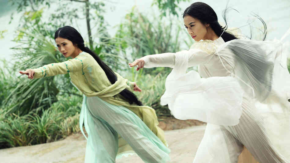 The demon snake sisters (Charlene Choi and Eva Huang) disguise themselves as beautiful women in The Sorcerer and the White Snake. The demon snake sisters (Charlene Choi and Eva Huang) disguise themselves as beautiful women in The Sorcerer and the White Snake.