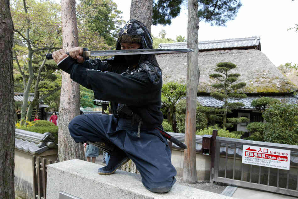 An authentic master of ninjutsu martial art, Kazuki Ukita poses in Ninja costume at the Ninja museum's Ninja residence in the small ancient city of Ueno.