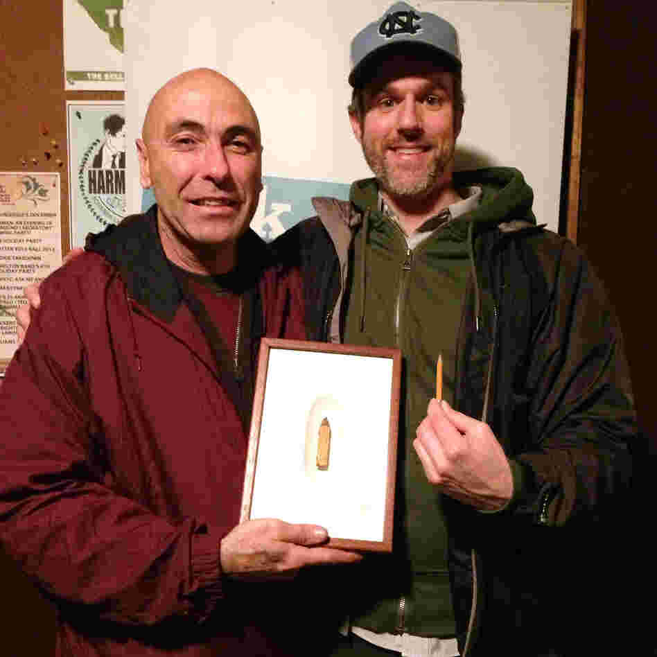 V.I.P. David Rees (right) and artist Dalton Ghetti. Ghetti brought one of his pieces to the show, a tiny boot he carved into the tip of a carpenter's pencil. V.I.P. David Rees (right) and artist Dalton Ghetti. Ghetti brought one of his pieces to the show, a tiny boot he carved into the tip of a carpenter's pencil.