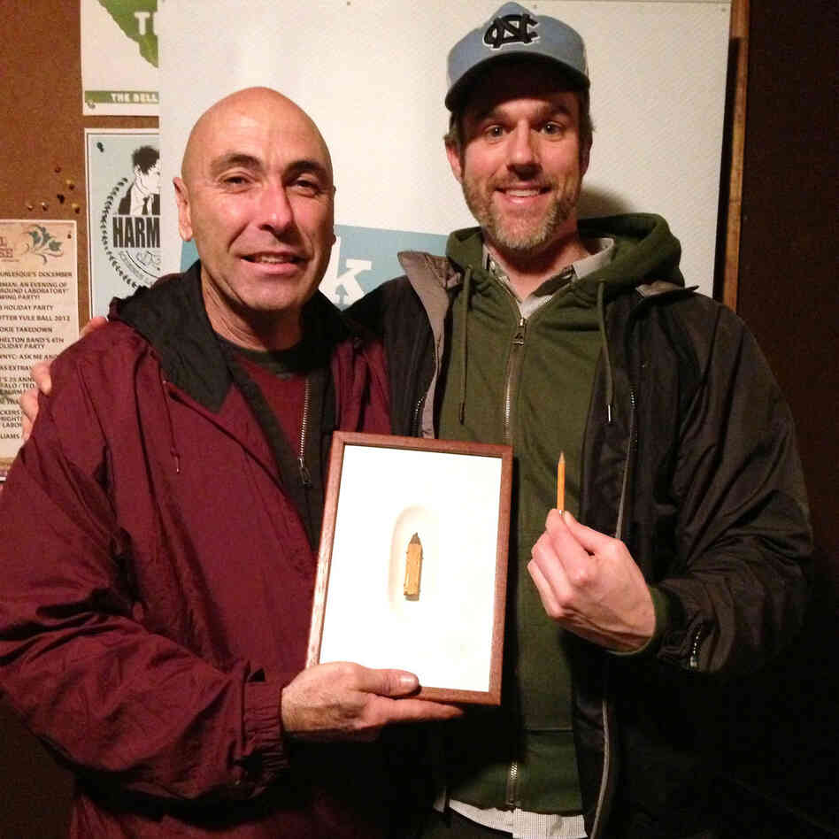 V.I.P. David Rees (right) and artist Dalton Ghetti. Ghetti brought one of his pieces to the show, a tiny boot he carved into the tip of a carpenter's pencil. V.I.P. David Rees (right) and artist Dalton Ghetti. Ghetti brought one of his pieces to the show, a tiny boot he carved into the tip of a carpenter's pencil.