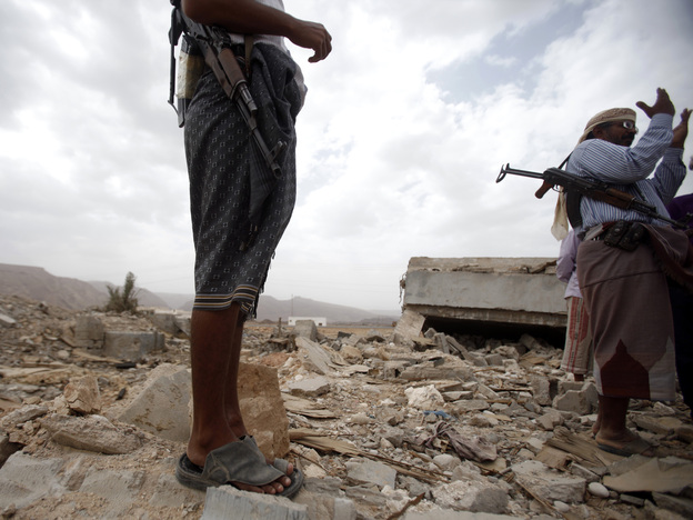 October 2011: Men stand on the rubble of a building destroyed by a U.S. drone  strike in southeastern Yemen. Among those killed was U.S. citizen  Abdulrahman al-Awlaki, the son of U.S.-born cleric Anwar al-Awlaki — who  himself was killed by a drone strike the month before.