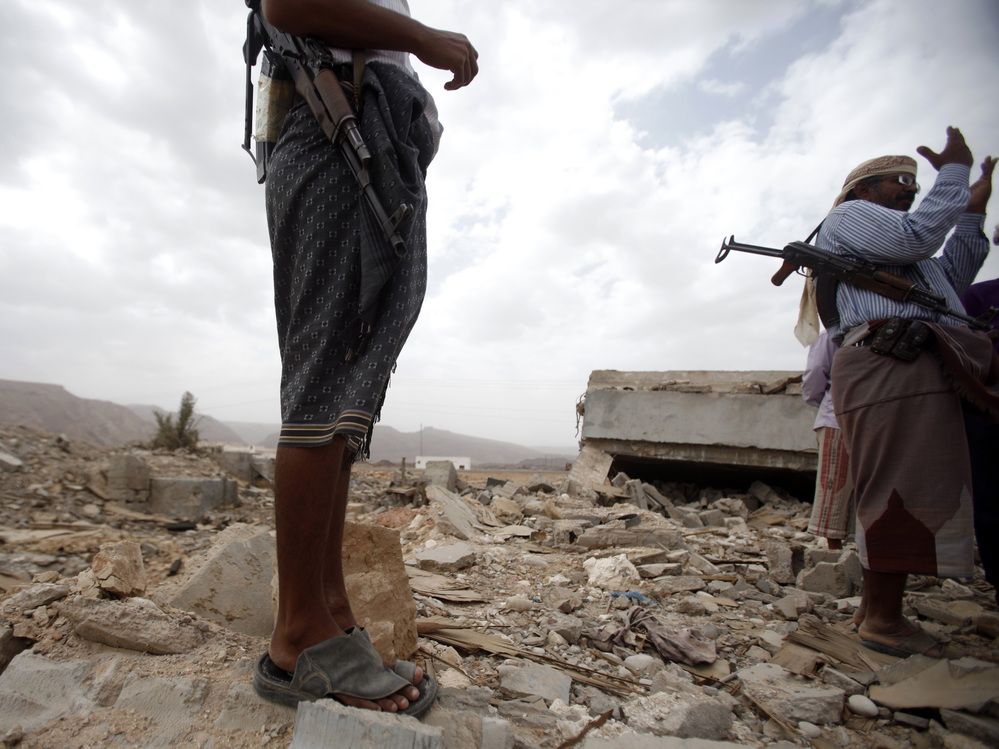 October 2011: Men stand on the rubble of a building destroyed by a U.S. drone  strike in southeastern Yemen. Among those killed was U.S. citizen  Abdulrahman al-Awlaki, the son of U.S.-born cleric Anwar al-Awlaki — who  himself was killed by a drone strike the month before.