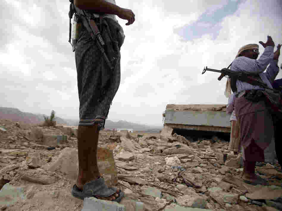 October 2011: Men stand on the rubble of a building destroyed by a U.S. drone  strike in southeastern Yemen. Among those killed was U.S. citizen  Abdulrahman al-Awlaki, the son of U.S.-born cleric Anwar al-Awlaki — who  himself was killed by a drone strike the month before.