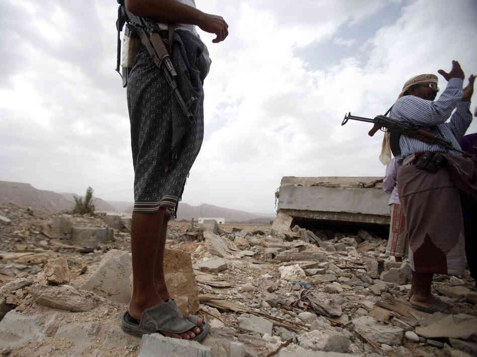 October 2011: Men stand on the rubble of a building destroyed by a U.S. drone  strike in southeastern Yemen. Among those killed was U.S. citizen  Abdulrahman al-Awlaki, the son of U.S.-born cleric Anwar al-Awlaki — who  himself was killed by a drone strike the month before.