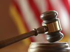 A gavel in a courtroom. A gavel in a courtroom.