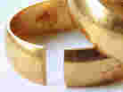 Image of a wedding ring, with part of it missing. Image of a wedding ring, with part of it missing.