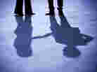 A businesswoman and businessman shake hands. A businesswoman and businessman shake hands.