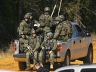 Law enforcement officials, including some from the FBI, near the scene of the hostage situation in Midland City, Ala., on Friday. Law enforcement officials, including some from the FBI, near the scene of the hostage situation in Midland City, Ala., on Friday.