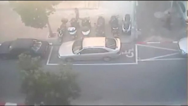 A car after it was painted into a handicapped space.