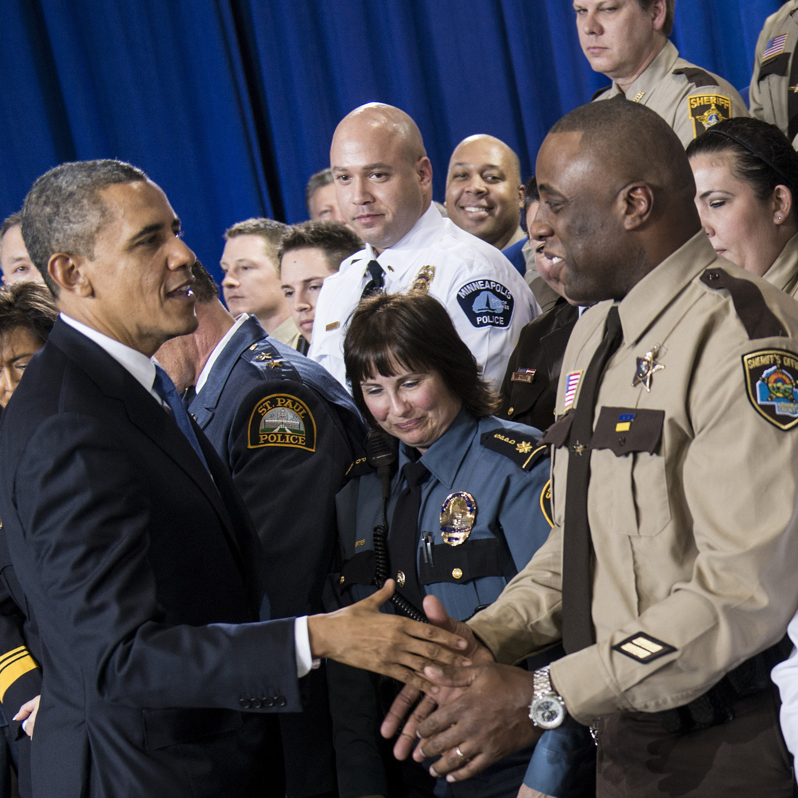 President Obama greets local law enforcement after speaking about gun violence at the Minneapolis Police Department's special operations center on Feb. 4.