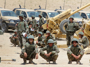 Afghan soldiers conduct an artillery training exercise in the northwest province of Badghis in July 2012.