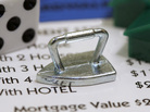 The Monopoly iron token that was replaced by the new cat token. The Monopoly iron token that was replaced by the new cat token.
