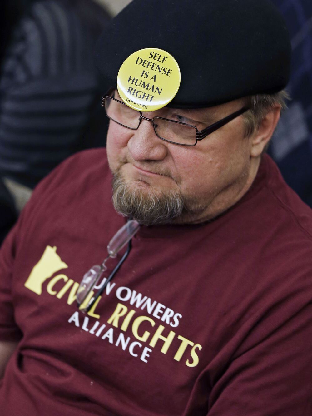 Gun rights advocate Andy Cers of Minneapolis listens to testimony during a Minnesota House hearing on gun violence bills Tuesday in St. Paul.