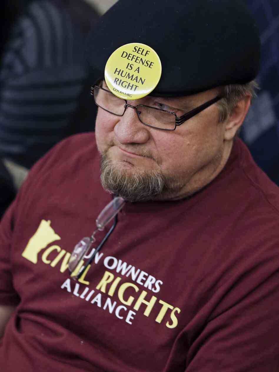 Gun rights advocate Andy Cers of Minneapolis listens to testimony during a Minnesota House hearing on gun violence bills Tuesday in St. Paul.