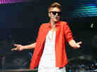 Justin Bieber on stage in December. Bieber's 2012 album Believe, despite selling over 1,000,000 copies, wasn't nominated for a single Grammy Award.