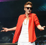Justin Bieber on stage in December. Bieber's 2012 album Believe, despite selling over 1,000,000 copies, wasn't nominated for a single Grammy Award.