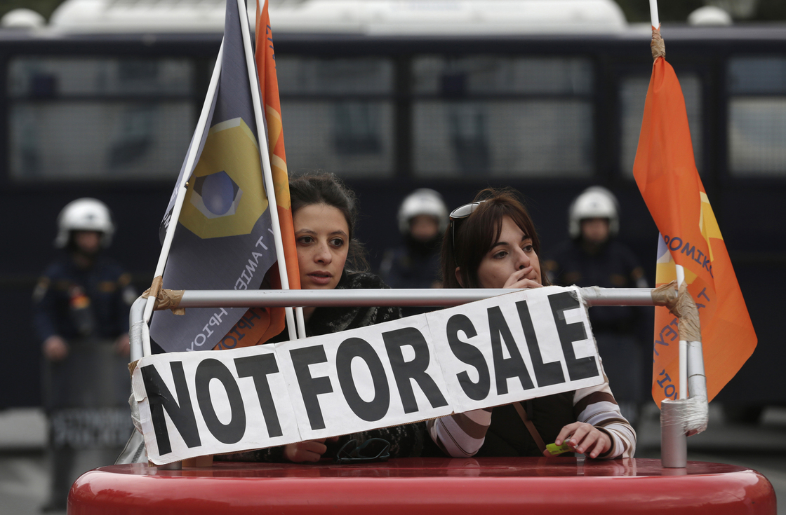 Employees of Hellenic Postbank protest during a strike against the bank's privatization in Athens, in December.