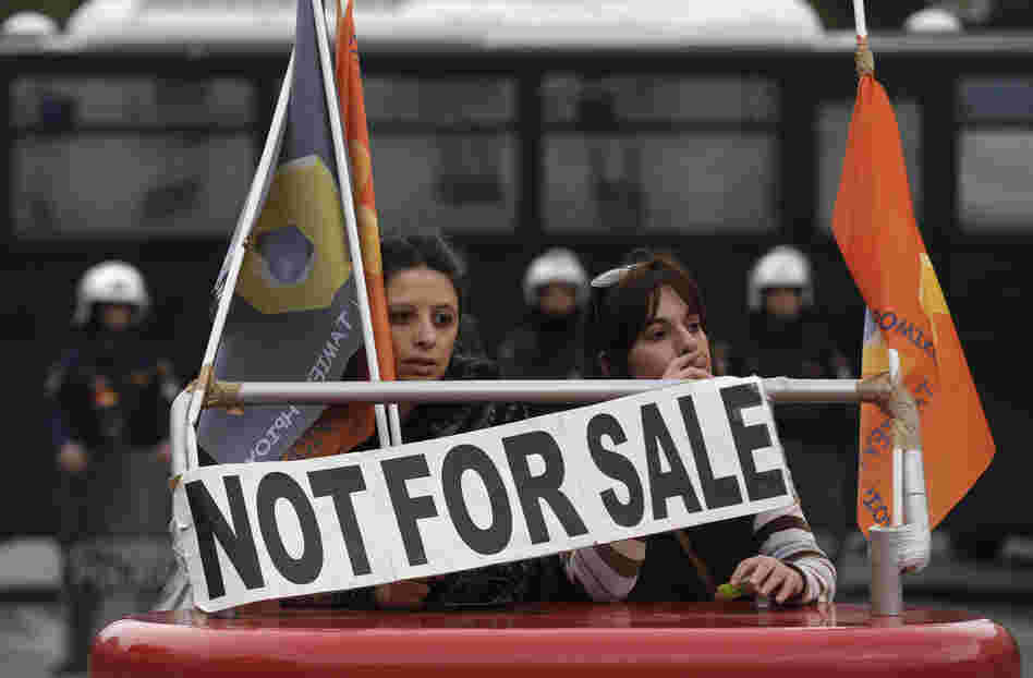 Employees of Hellenic Postbank protest during a strike against the bank's privatization in Athens, in December.