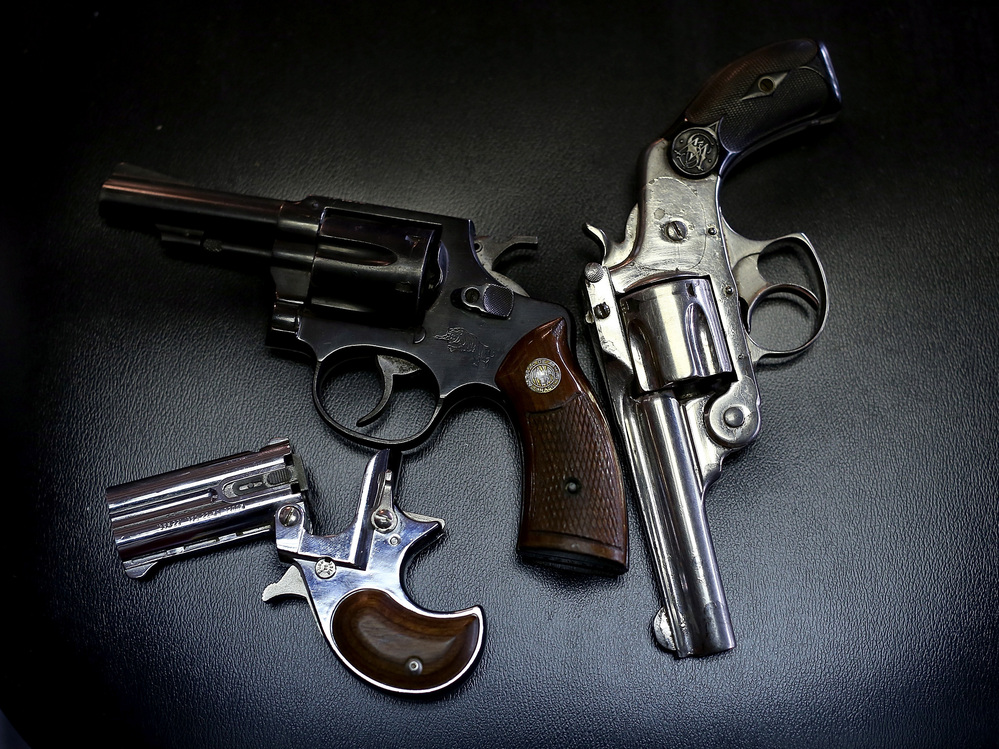 More than 400 guns, including these three, were turned in during a Dallas gun buyback program in January. But determining the effectiveness of such programs is difficult due to limits on gun-related research.