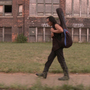 Rodriguez carries his guitar through Detroit, Mich., his hometown.