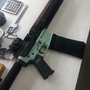 This AR-15 rifle's lower receiver (in soft green color) was produced with a 3-D printer. The 3-D printing industry has criticized the use of the technology for gun part making.