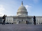 Tourists take photographs in front of the U.S. Capitol on Jan. 2, the day after Congress passed a bill to avoid the fiscal cliff. Tourists take photographs in front of the U.S. Capitol on Jan. 2, the day after Congress passed a bill to avoid the fiscal cliff.