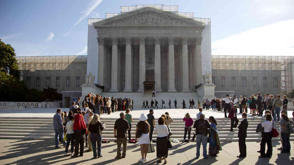 People wait in line to enter the Supreme Court as the term began in October.