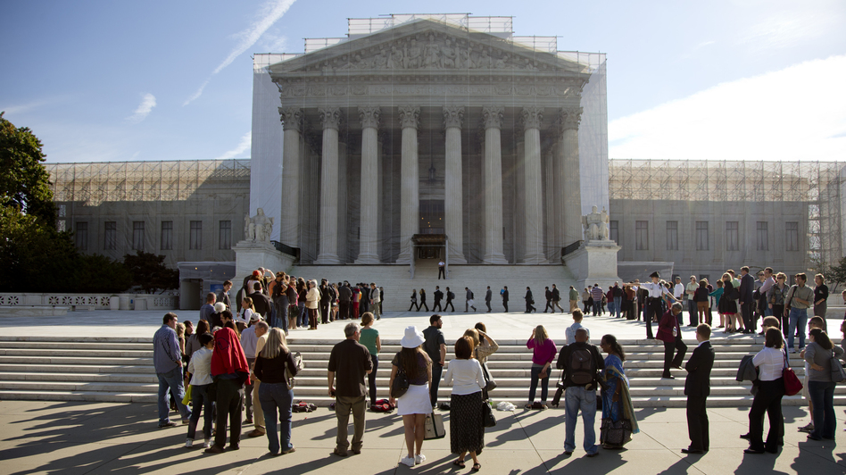 People wait in line to enter the Supreme Court as the term began in October.