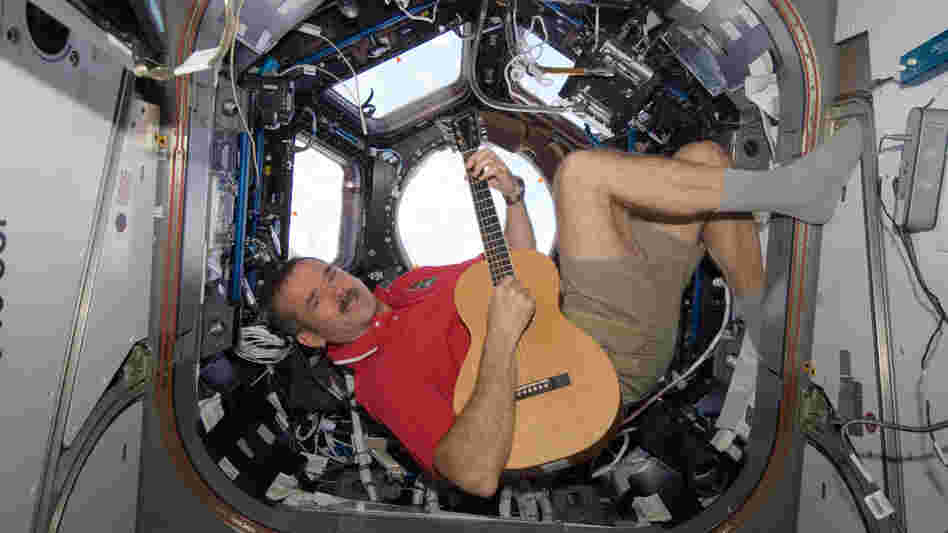 Canadian Space Agency astronaut Chris Hadfield strums his guitar, a Larrivee Parlor, on the International Space Station in December.
