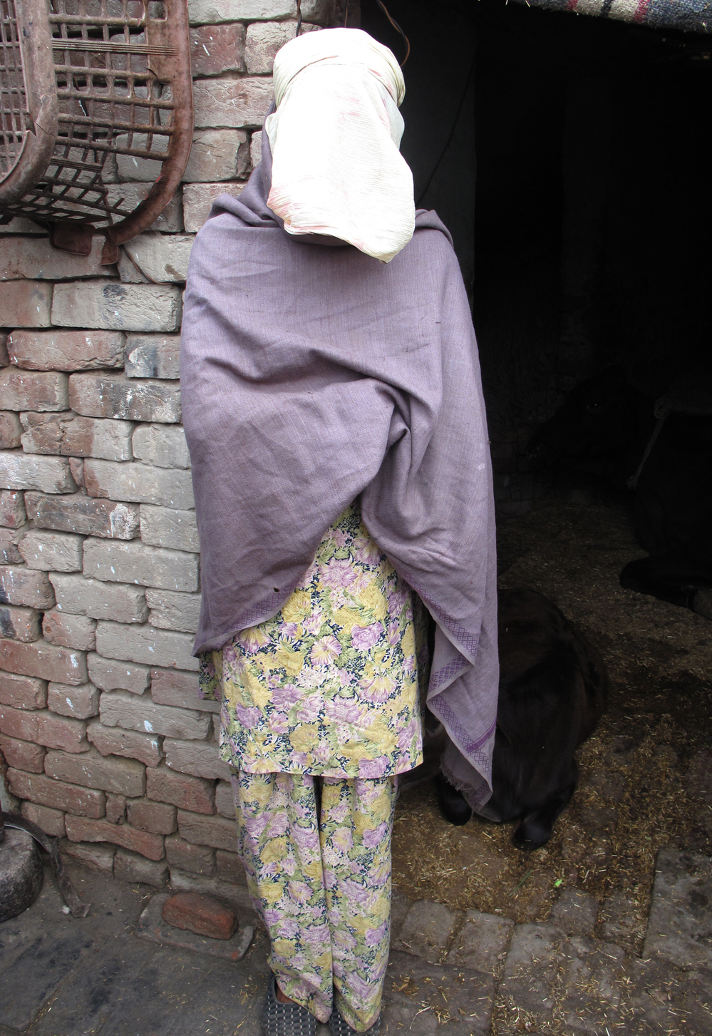 Roopa, the pseudonym for a gang rape victim in rural India, is shown at her home in the state of Haryana. Police were reluctant to investigate initially and the community has ostracized her. But her family has stood by her as she presses the case.