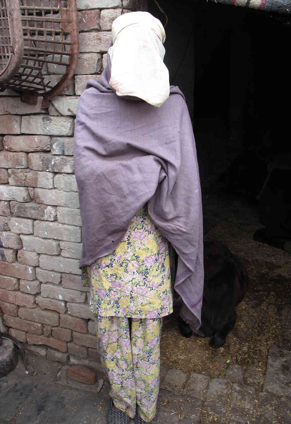 Roopa, the pseudonym for a gang rape victim in rural India, is shown at her home in the state of Haryana. Police were reluctant to investigate initially and the community has ostracized her. But her family has stood by her as she presses the case.
