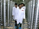 Iranian President Mahmoud Ahmadinejad (center) visits a uranium enrichment facility in Natanz, Iran, in 2008. Enriching uranium requires many fast-spinning centrifuges, arranged in what's called a cascade. Iranian President Mahmoud Ahmadinejad (center) visits a uranium enrichment facility in Natanz, Iran, in 2008. Enriching uranium requires many fast-spinning centrifuges, arranged in what's called a cascade.