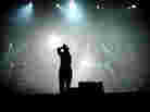 A teen sings on stage.