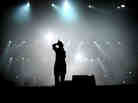 A teen sings on stage.